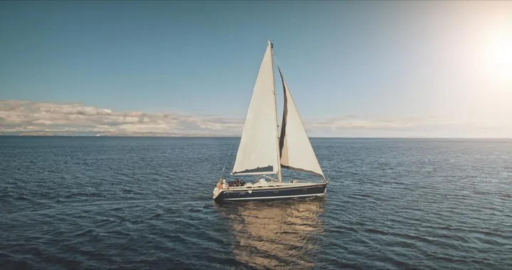 Sailing yacht under full sail on the open sea